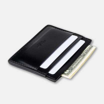 Black leather wallet with cards and money on a light gray background