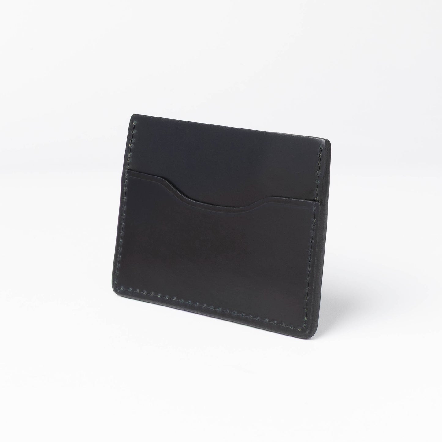 Black leather cardholder on a white background