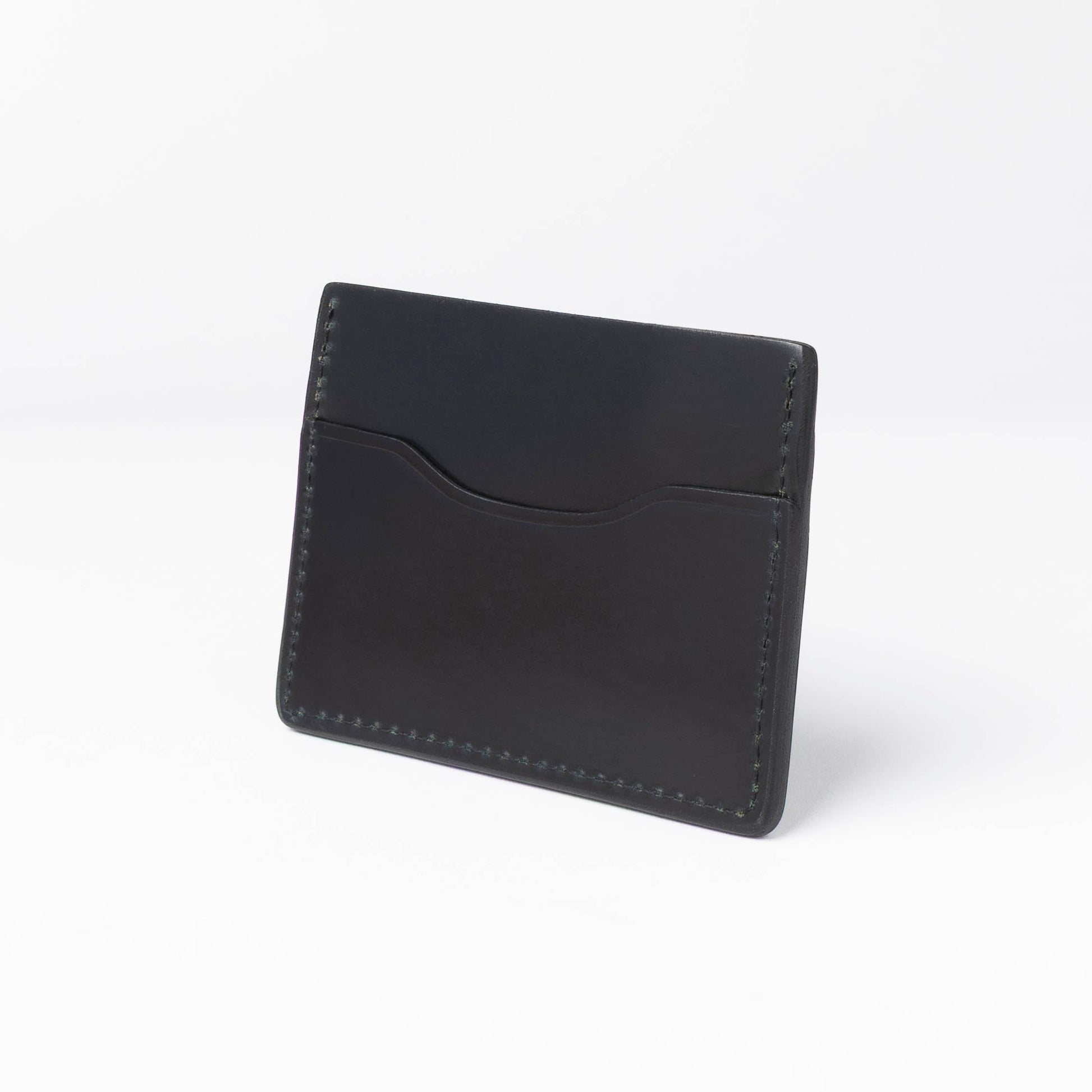 Black leather cardholder on a white background
