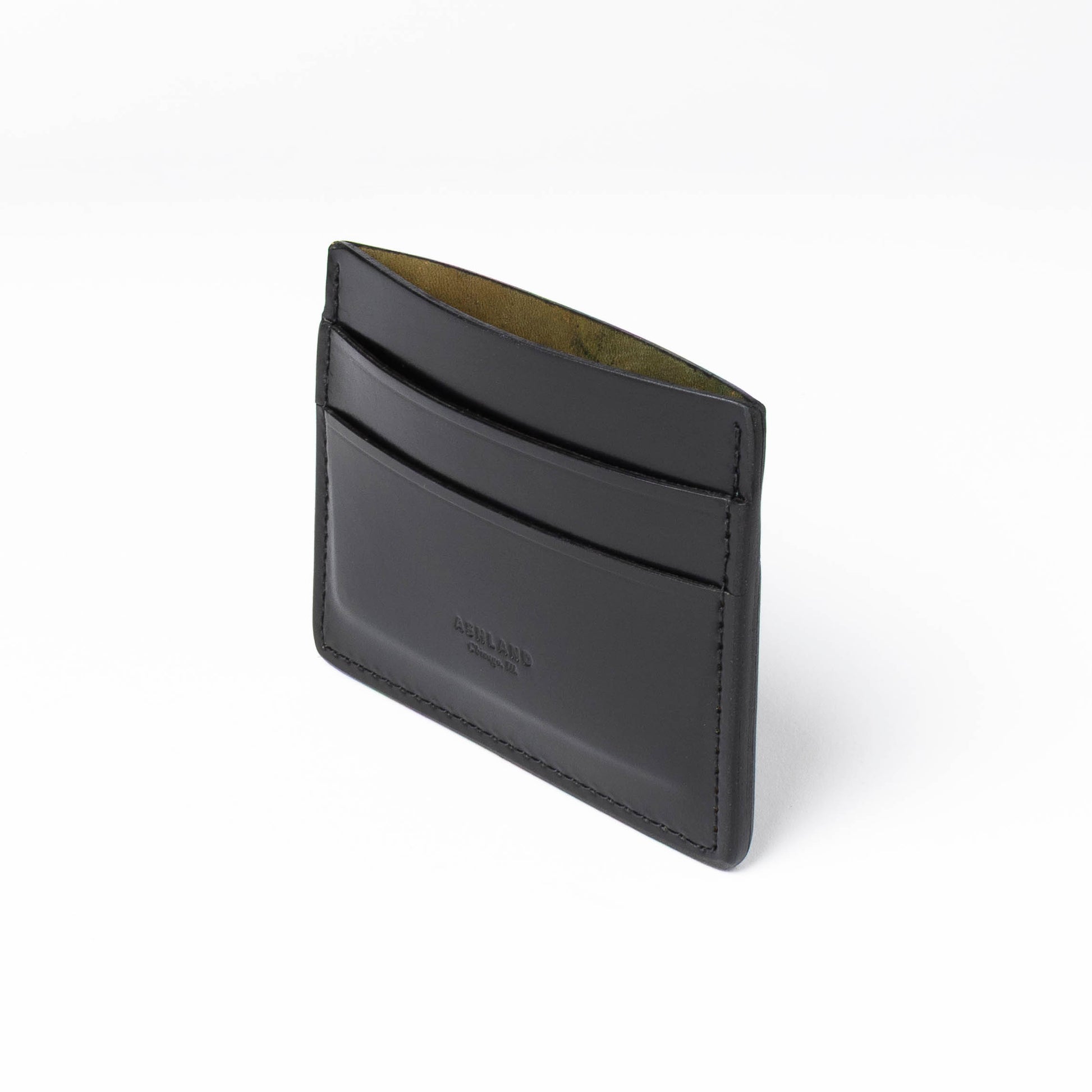 Black leather cardholder on a white background