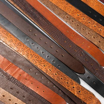 An assortment of textured Horween leather belts for men