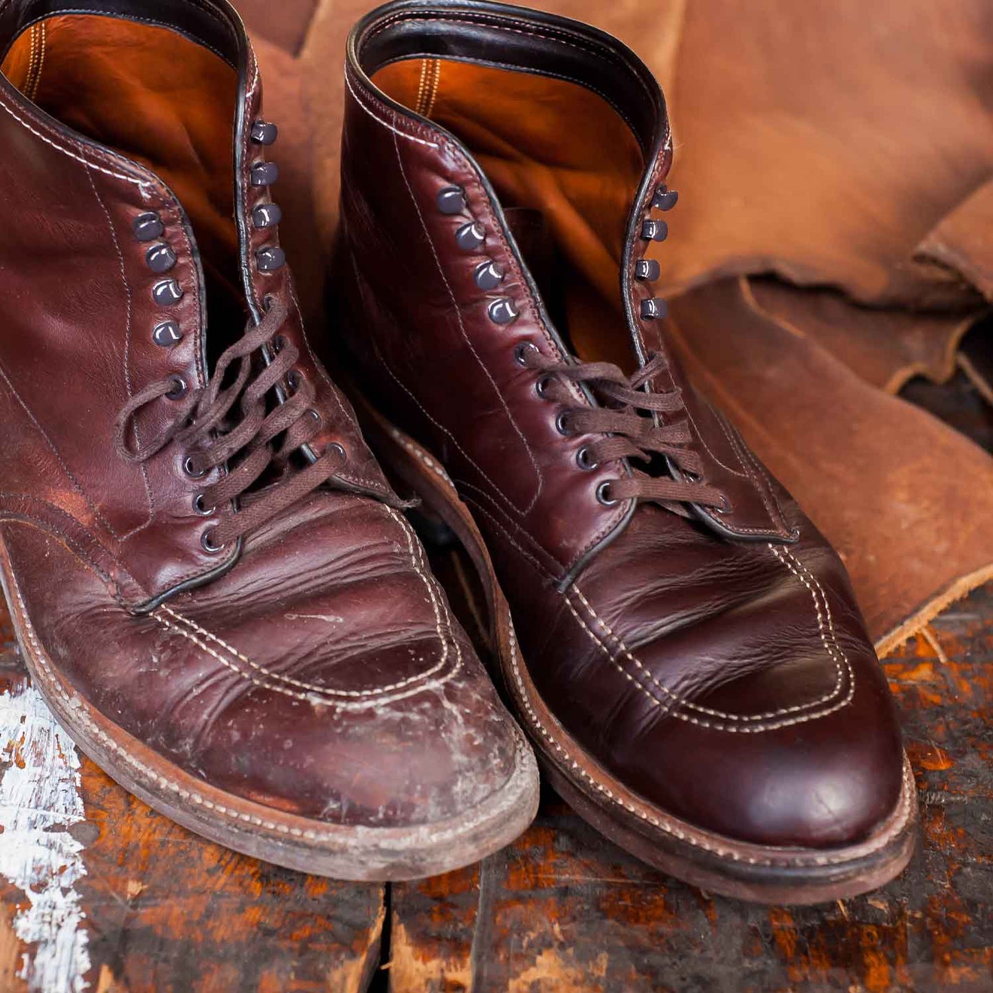 One worn and weathered boot on the left, one smooth and supple boot on the right after being restored with Tanner's Blend Leather Care Conditioner.