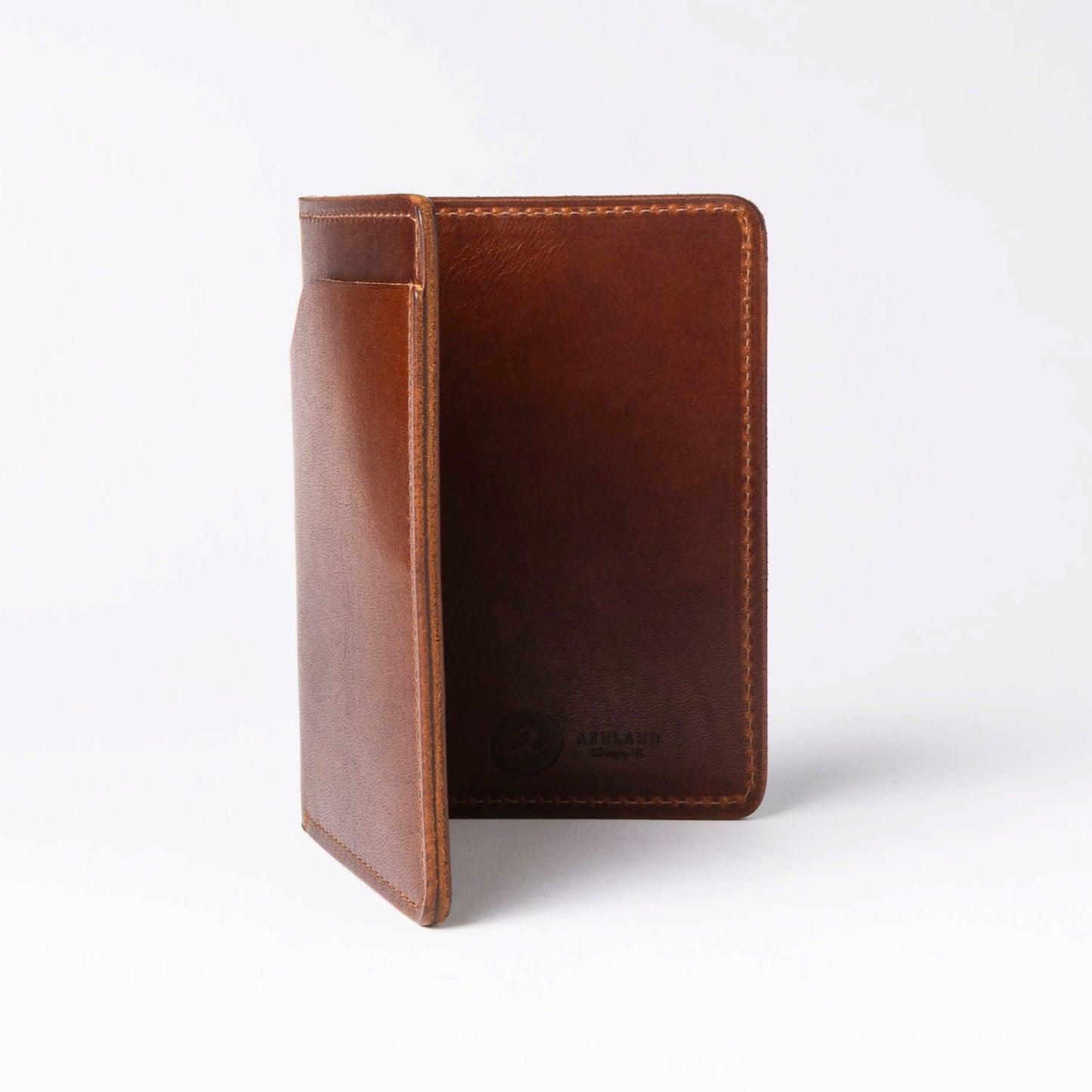 Brown leather passport holder on a white background