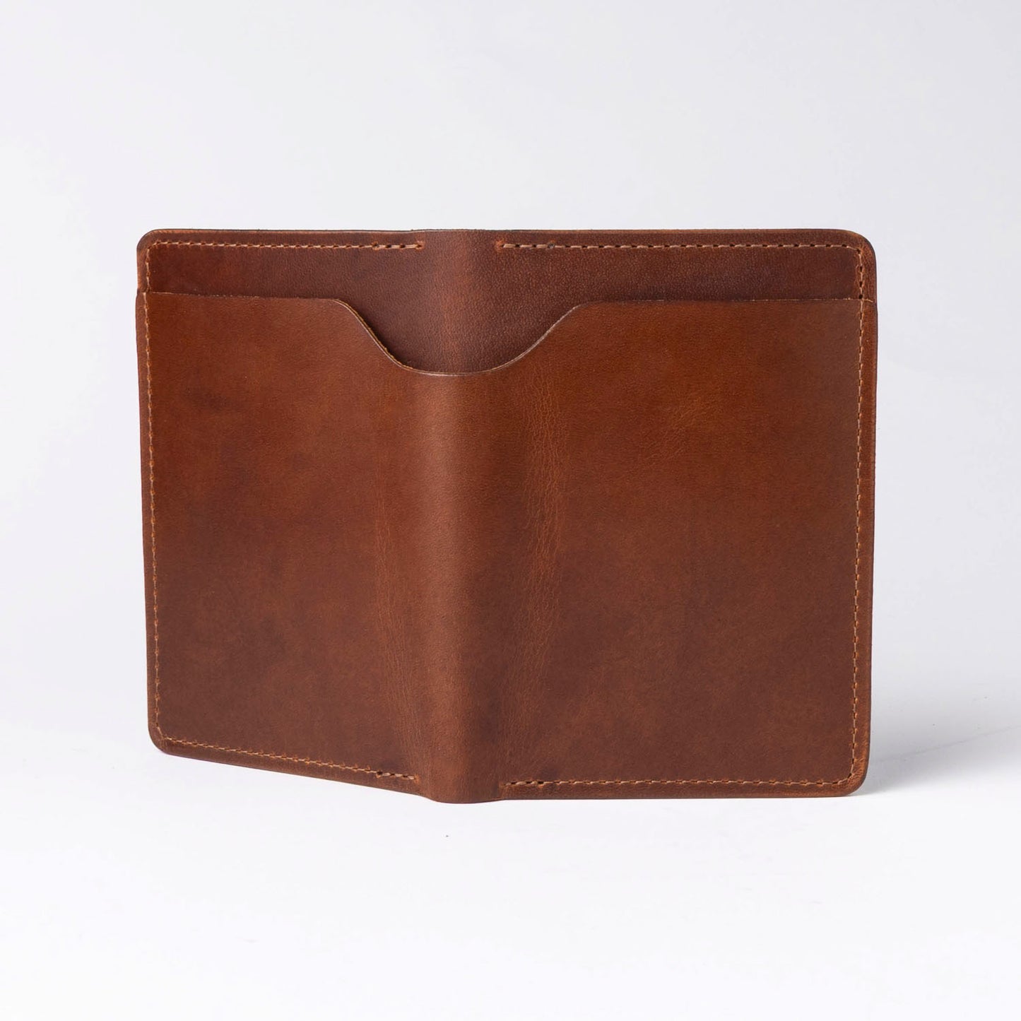Brown leather passport holder on a white background