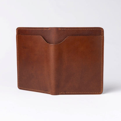Brown leather passport holder on a white background