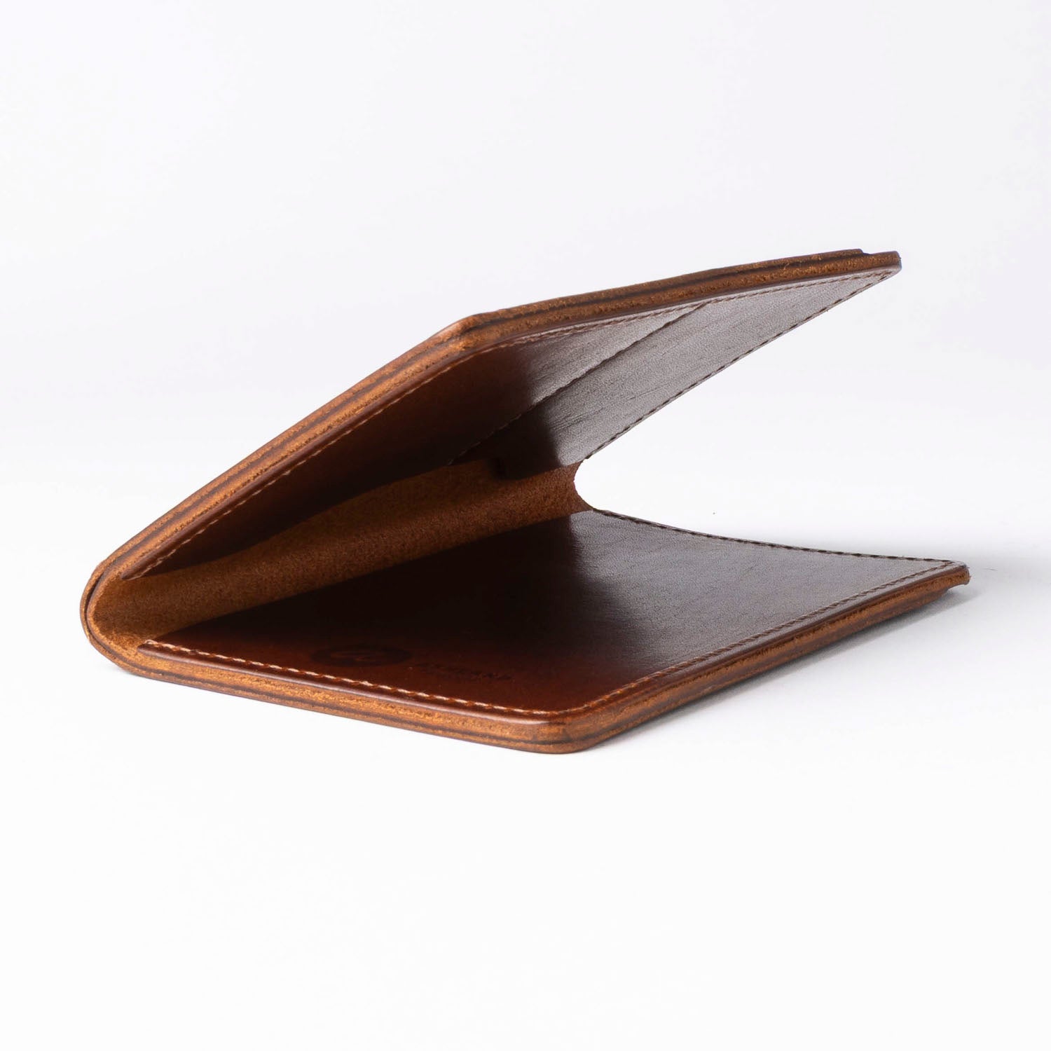 Brown leather passport holder on a white background