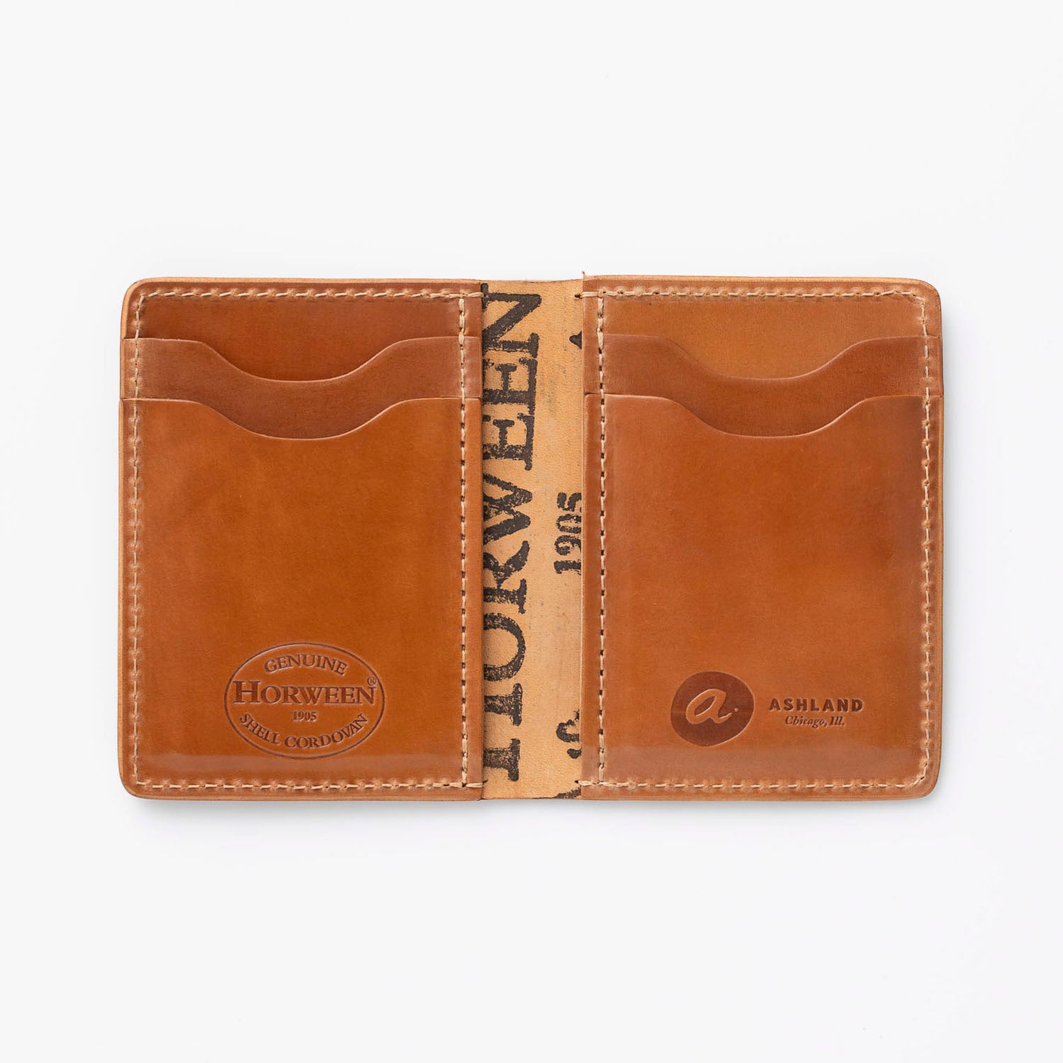 A brown leather cordovan wallet with card slots, open to show the interior with the brand name 'HORWEEN' visible on the upper flap.