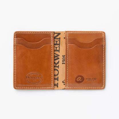 A brown leather cordovan wallet with card slots, open to show the interior with the brand name 'HORWEEN' visible on the upper flap.