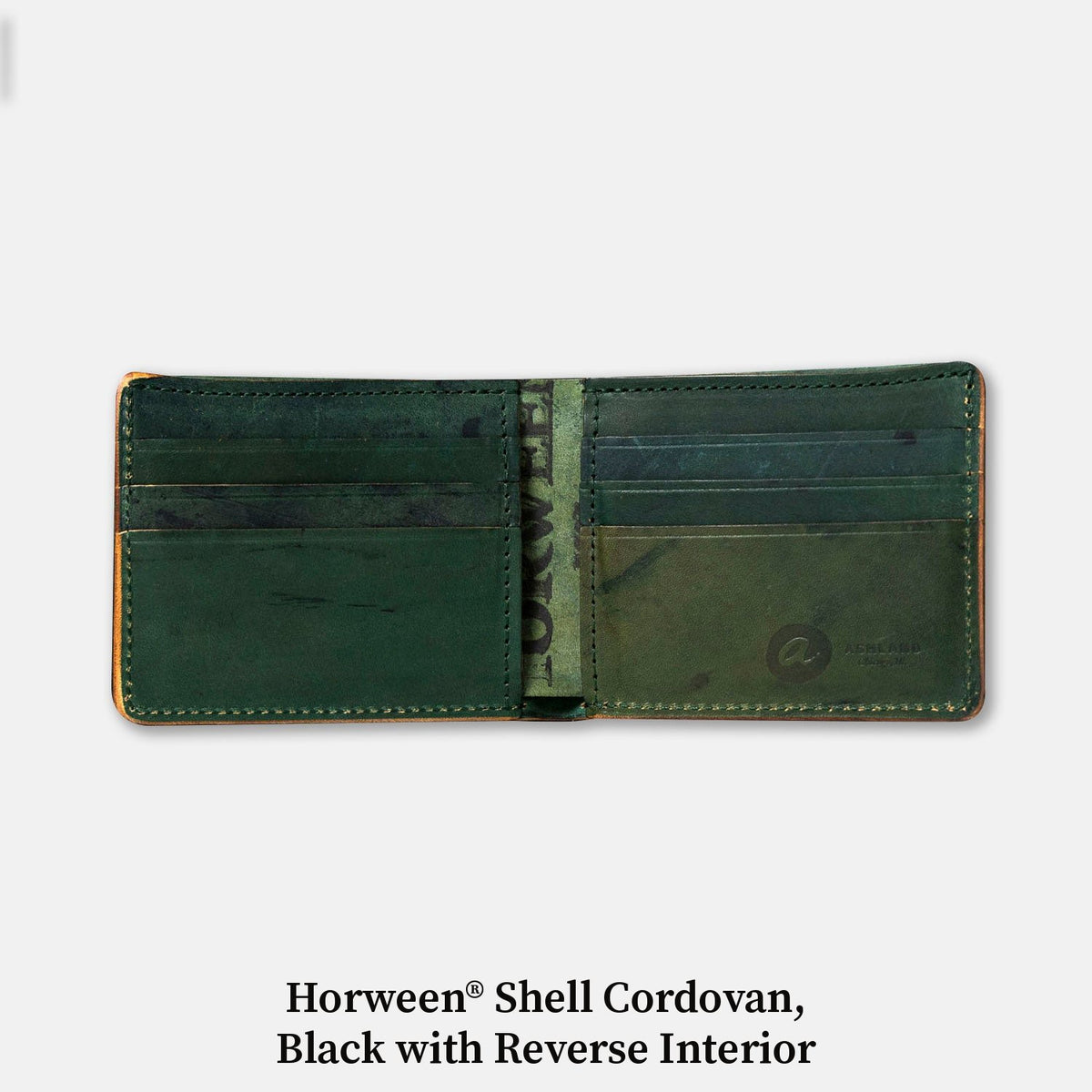Open Johnny the Fox wallet in Horween® Shell Cordovan, Black with Reverse Interior, showing the green interior