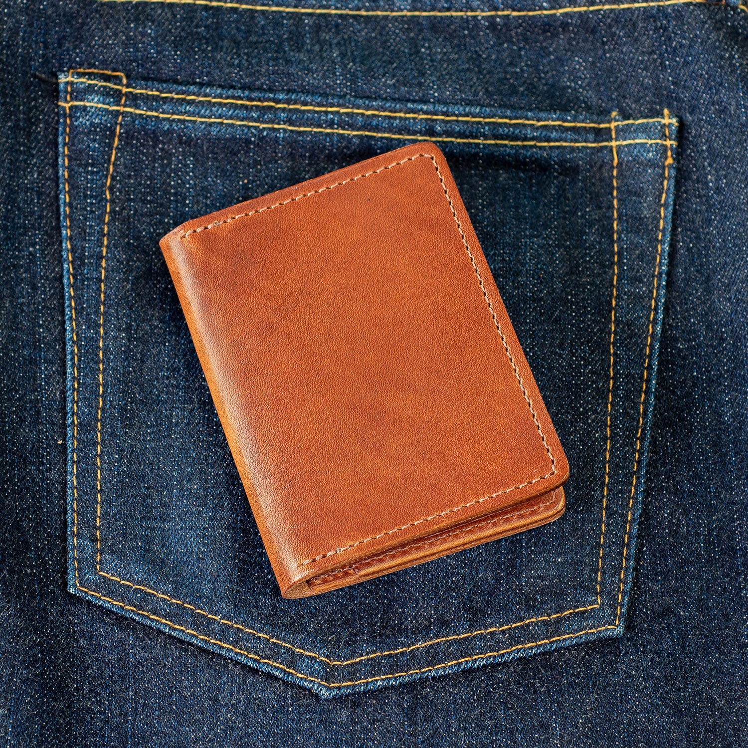 card holder wallet shown on dark denim