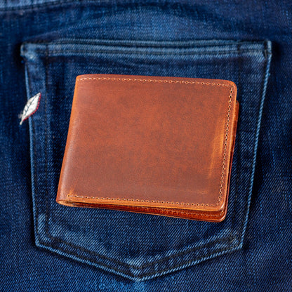 men's bifold wallet shown on selvedge denim