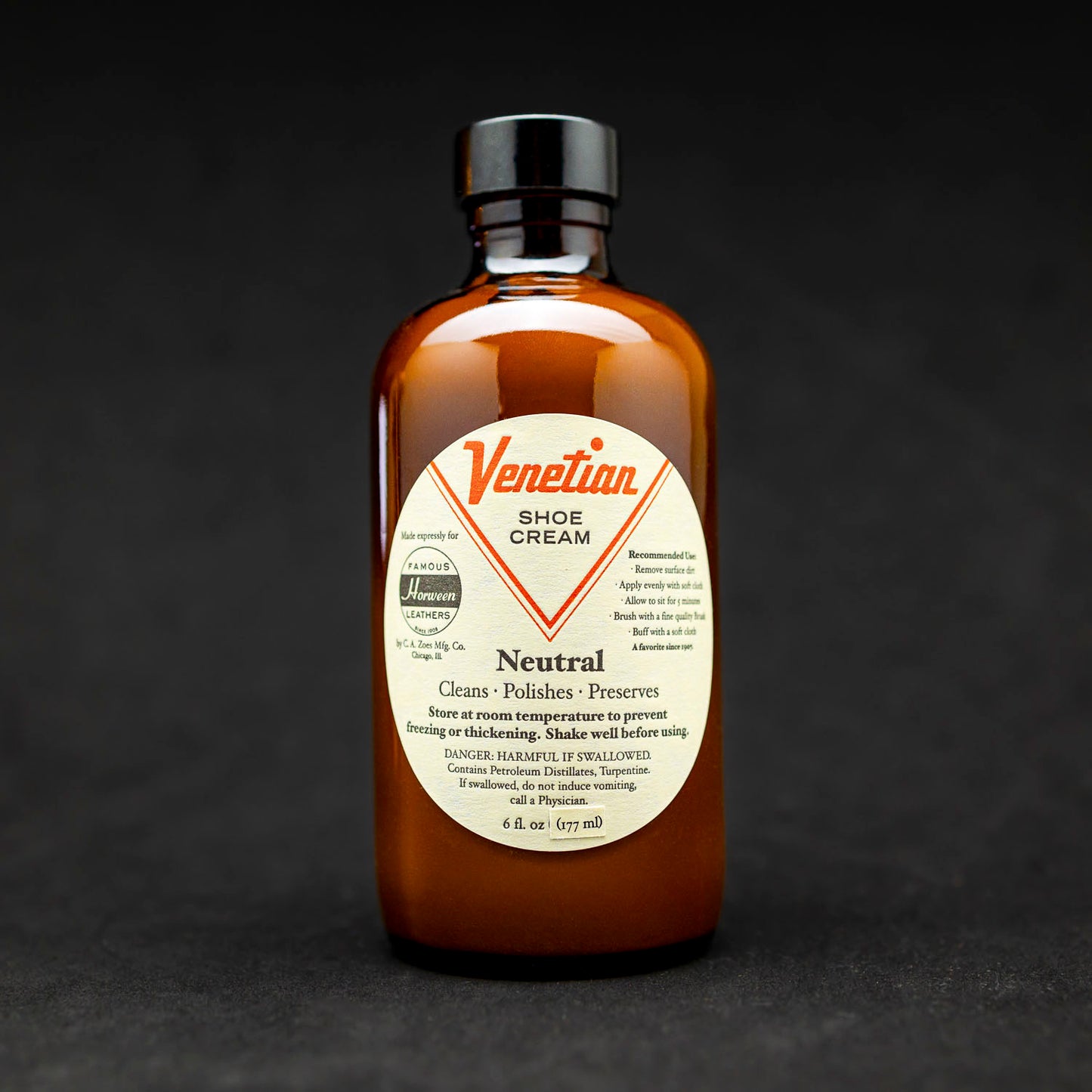 Bottle of venetian shoe cream, dark background